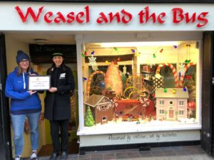 Dressed for Christmas Success: Chester’s storefronts are decorated with gingerbread