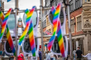 Chester pride flags with Eastgate Clock in the background