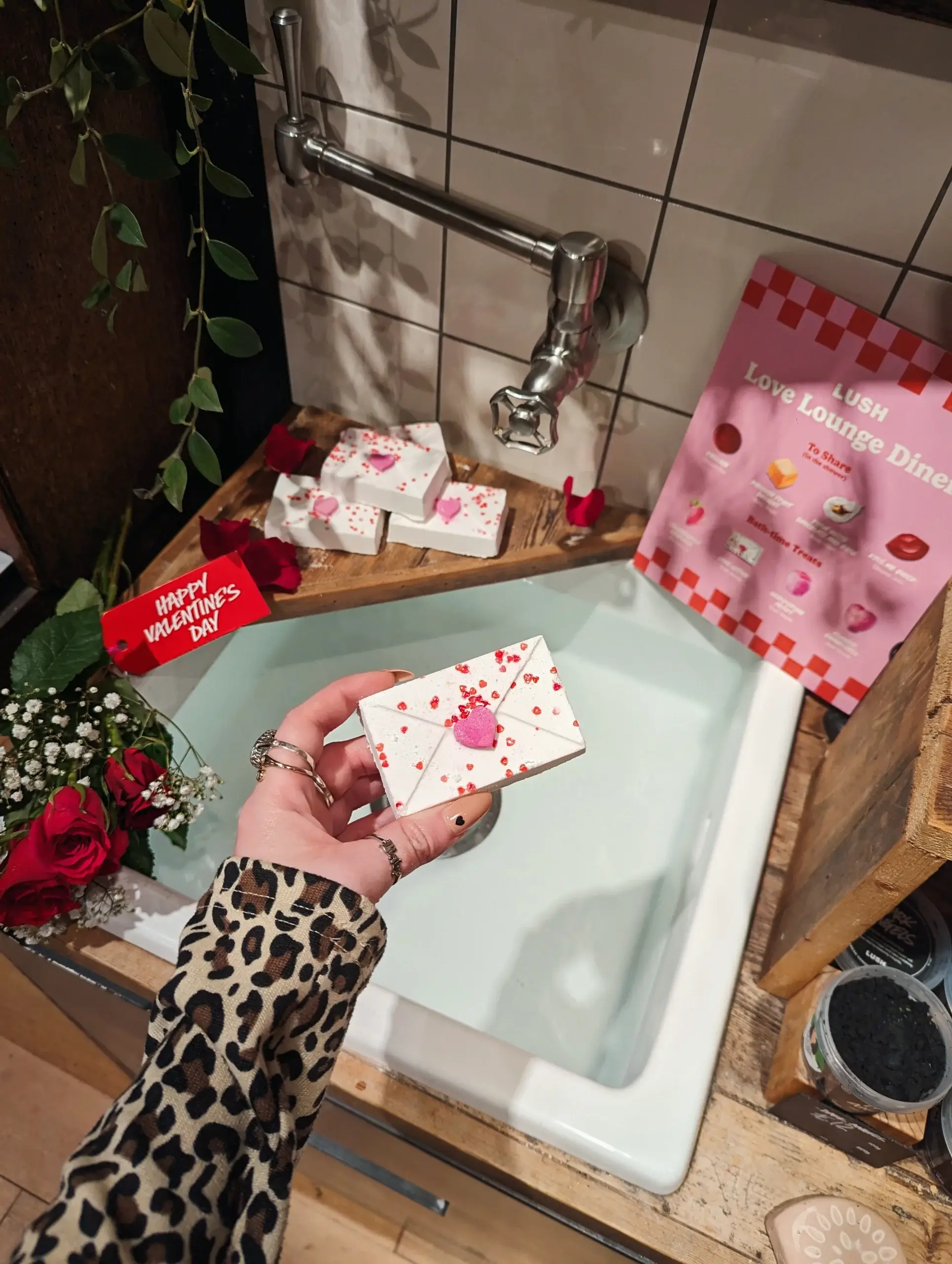 Love letter bath bomb placed over a sink