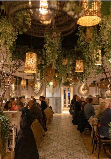 Inside of Neighbourhood bakehouse Chester with dimmed lighting and mediterranean feel