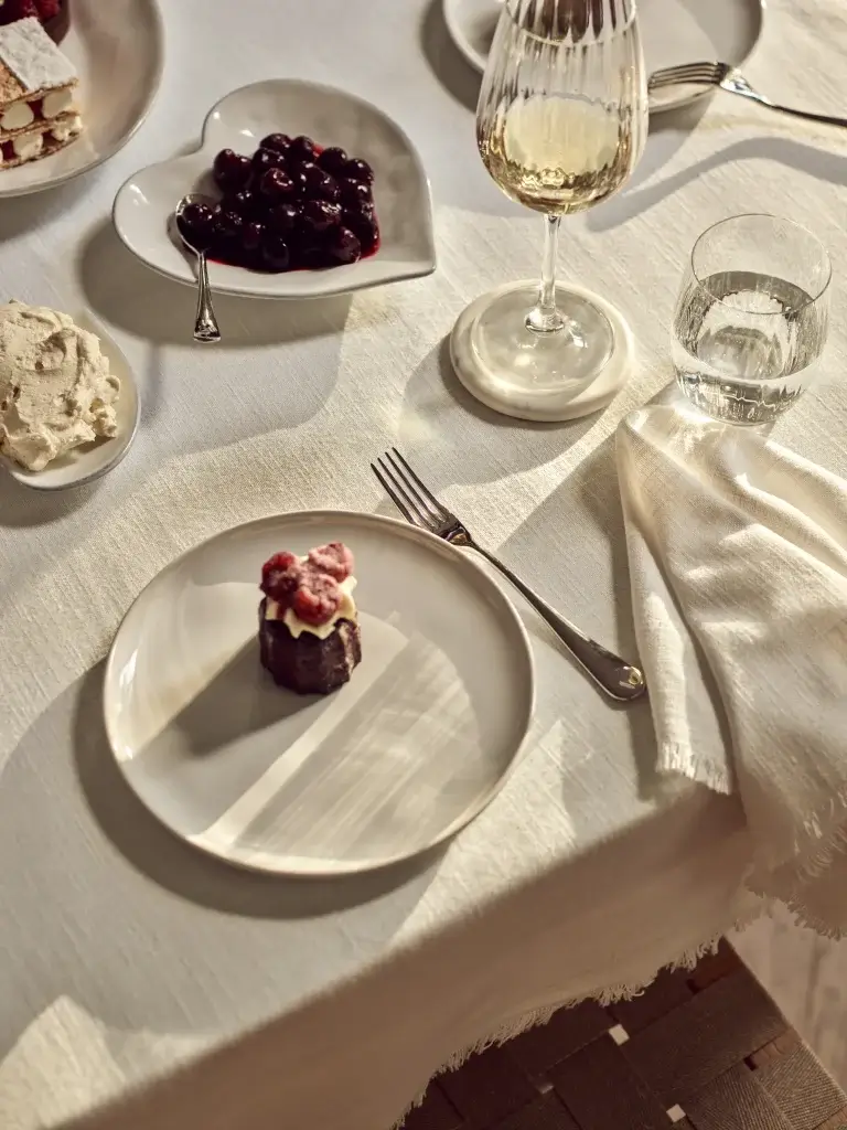 a dinner table with food and a plate on