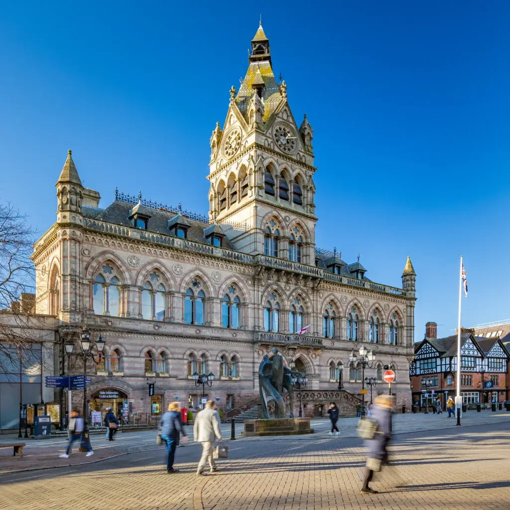 Chester's Historic Town Hall with people walking past